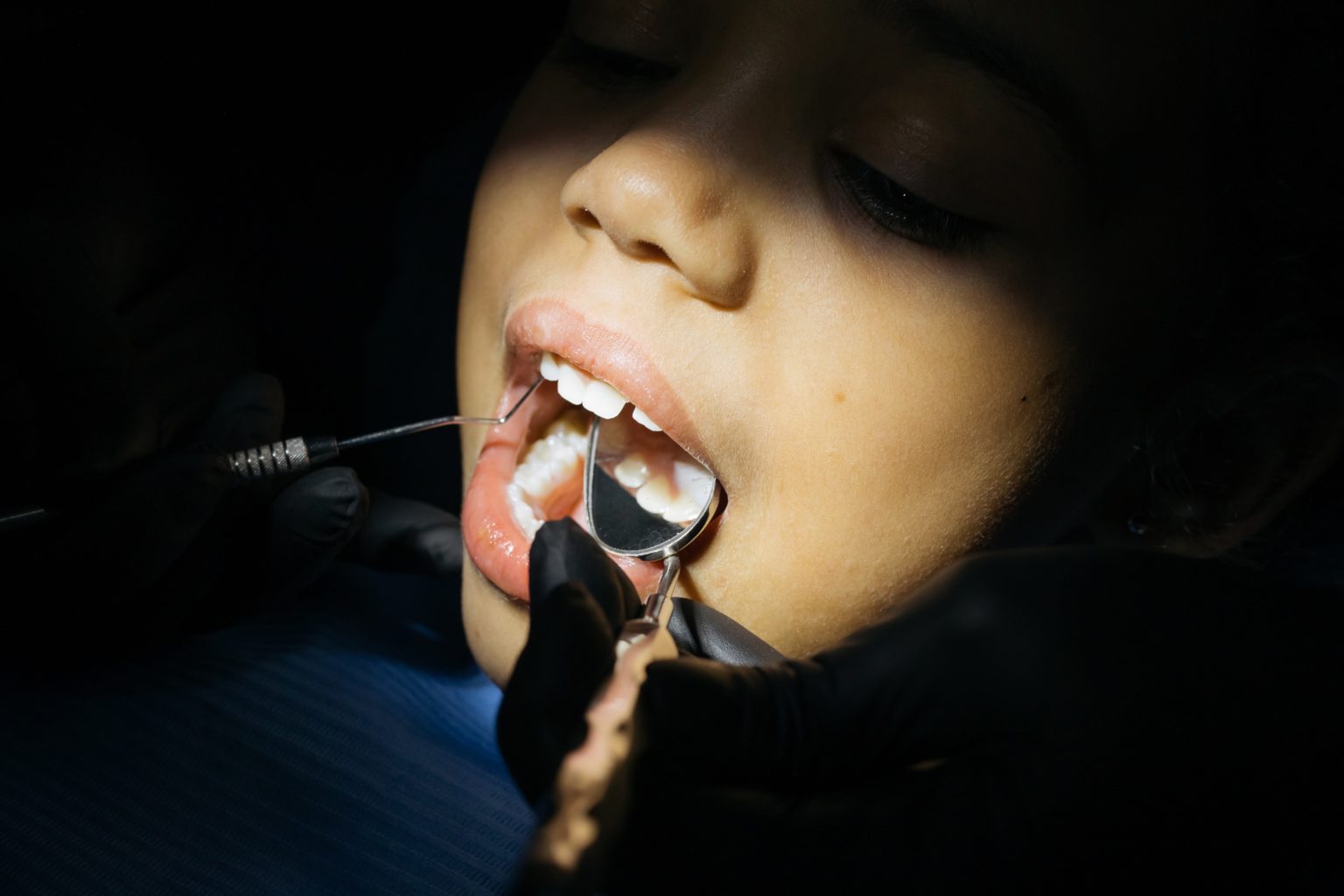 A kid having a dental checkup