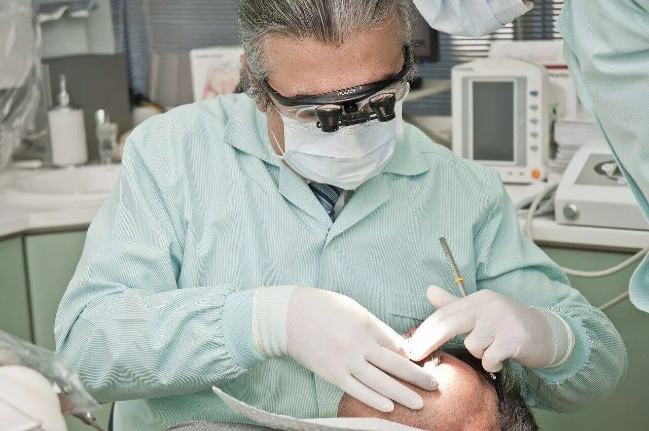 A dentist treating a patient