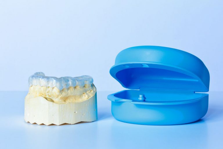 mouthguard on a model near a case