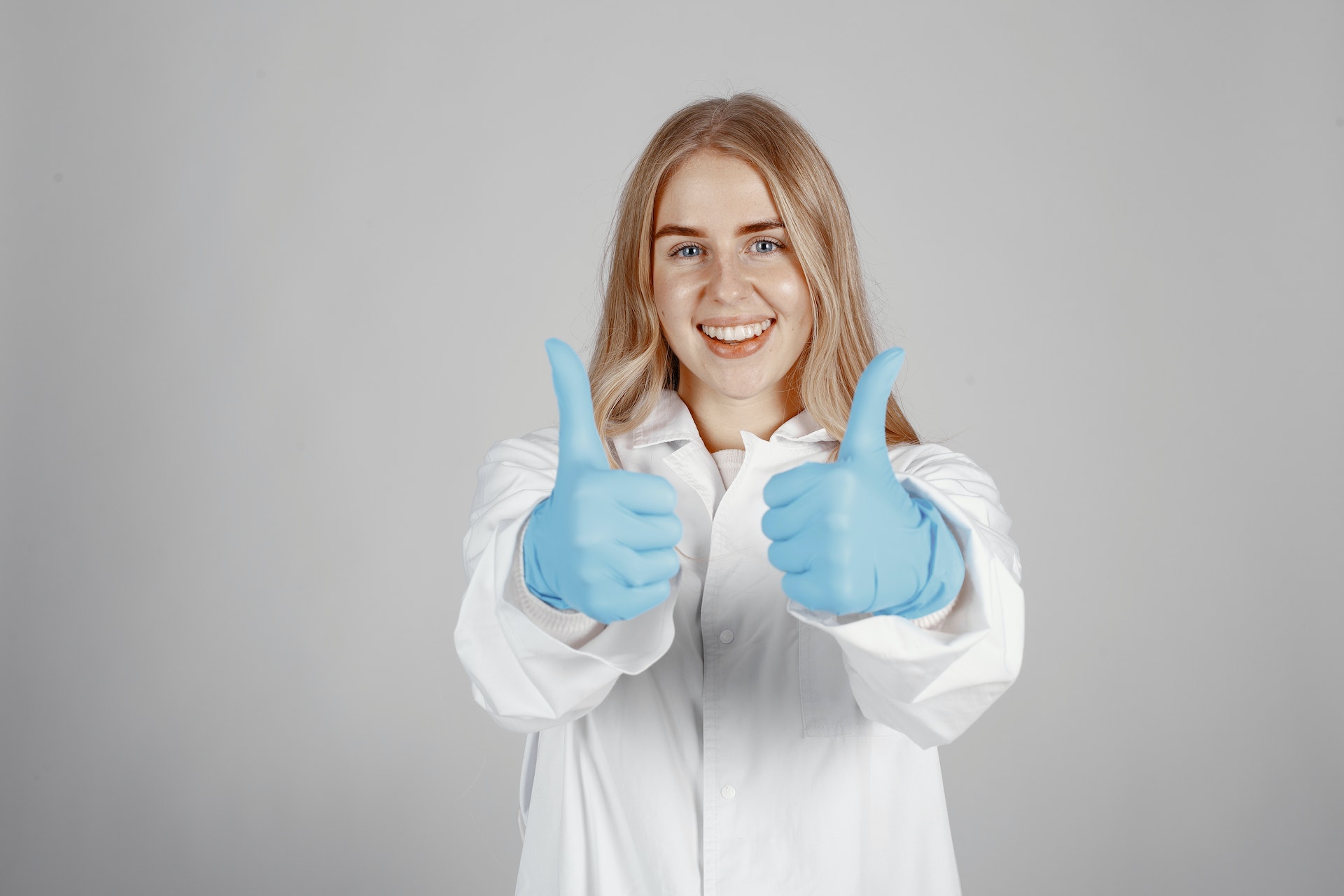 A dentist showing thumbs up