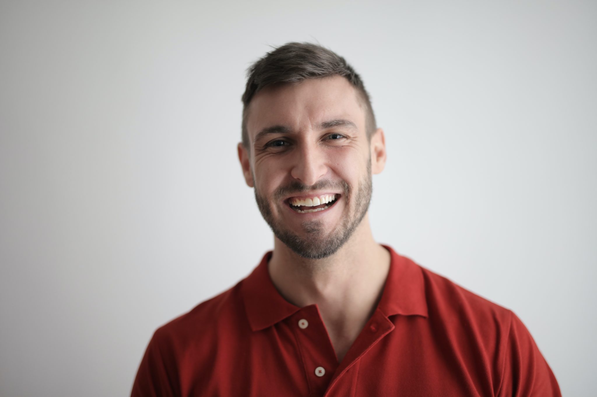 A man smiling after a dental cleaning