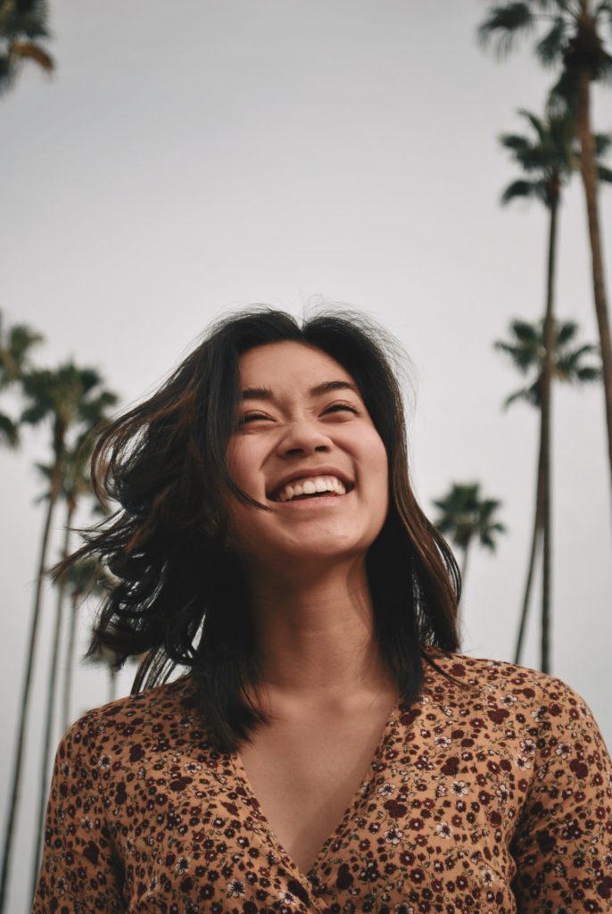 A girl outside with a bright smile