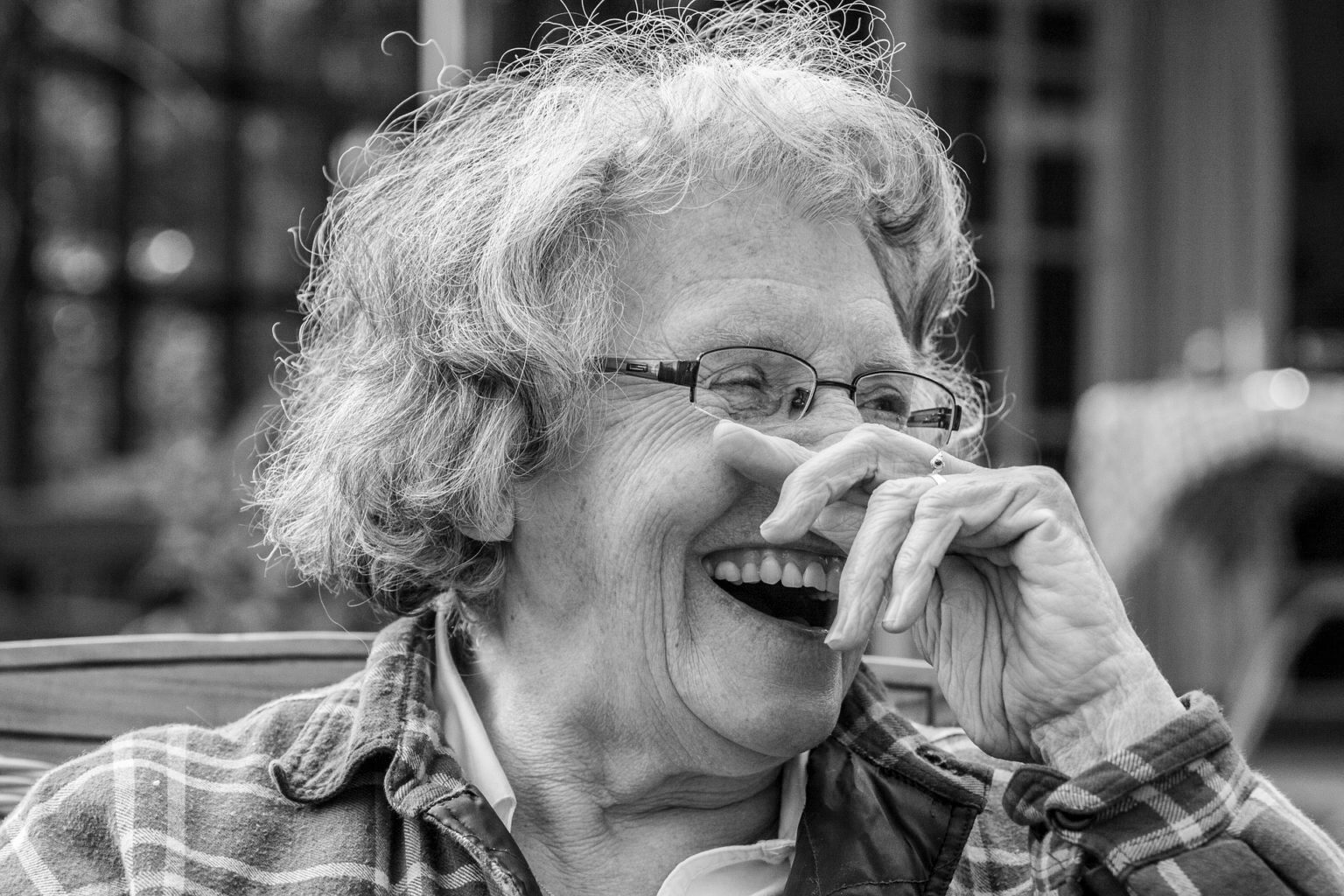A woman laughing replace teeth in dentures