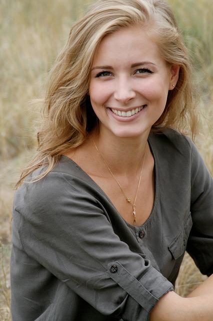 woman smiling in a field