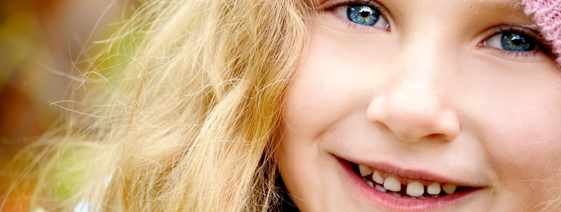 A close shot of a young girl smiling