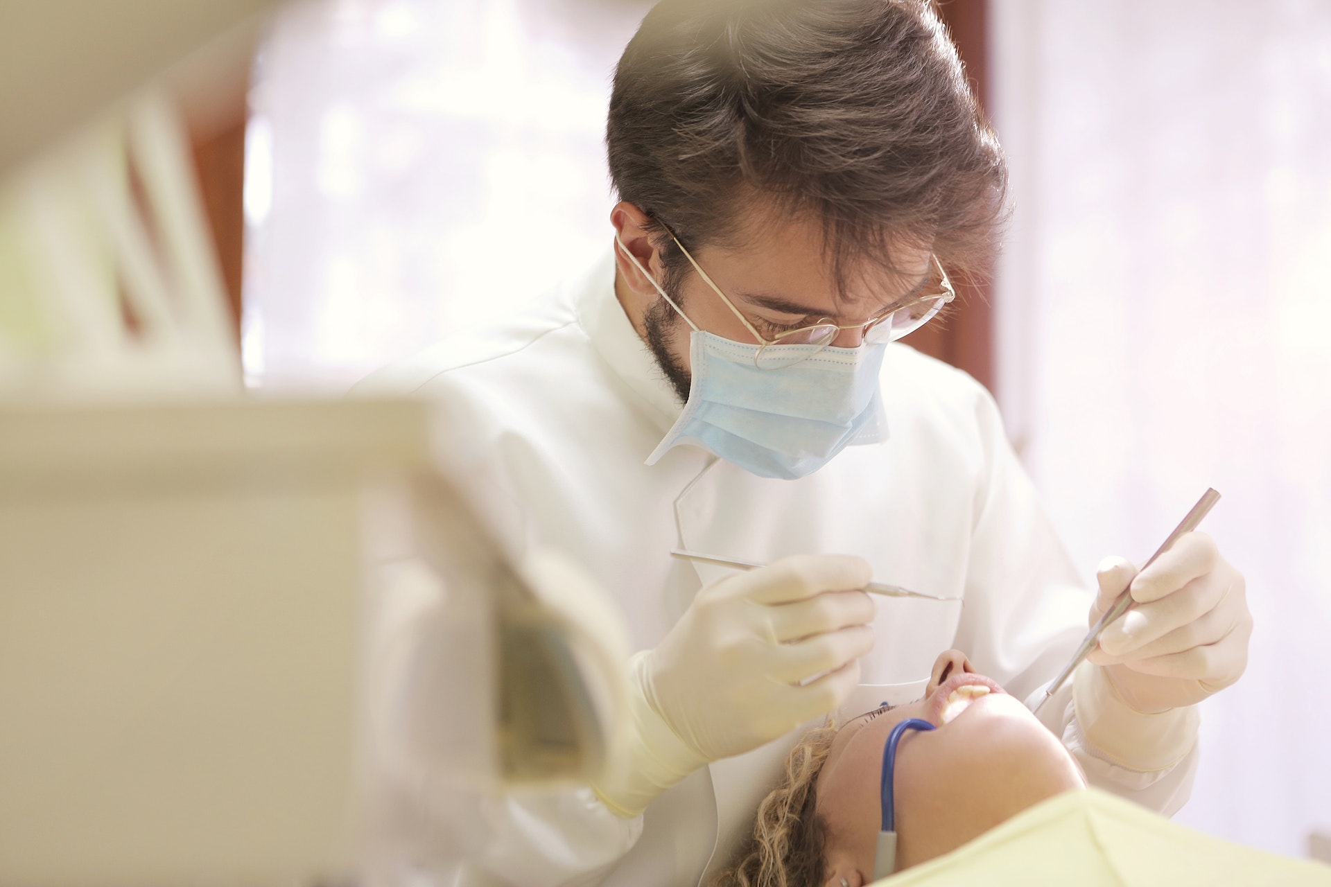 Dentist examining a patient’s teeth