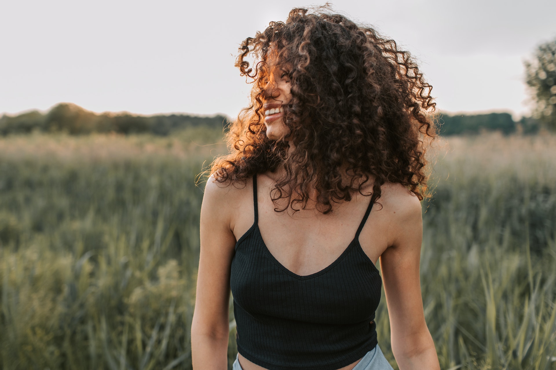 woman smiling into the distance