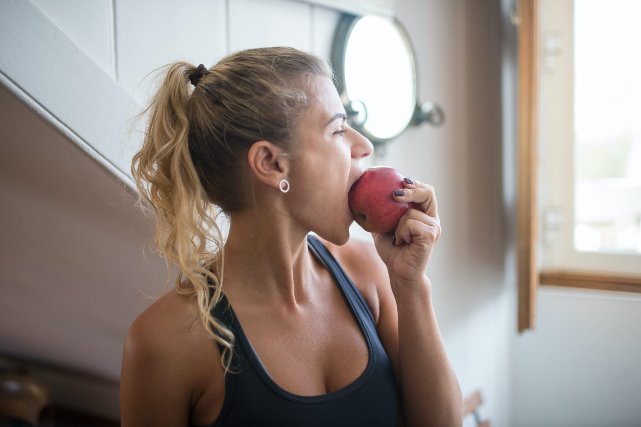 a woman eating an apple