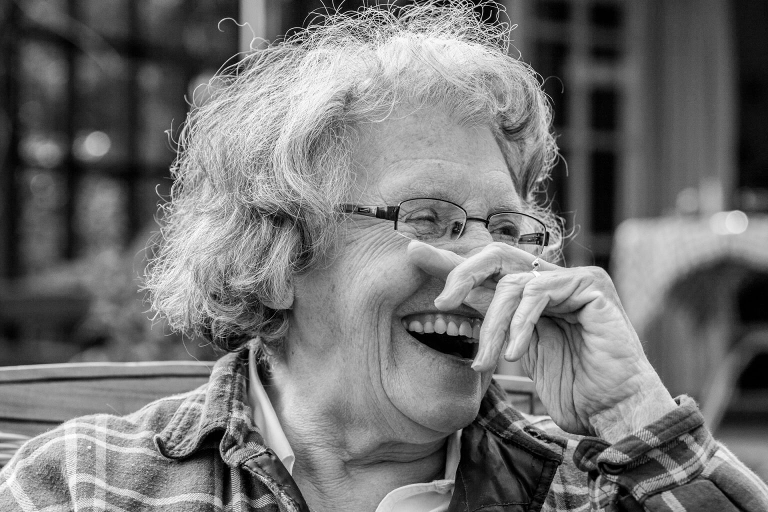 woman laughing replace teeth in dentures