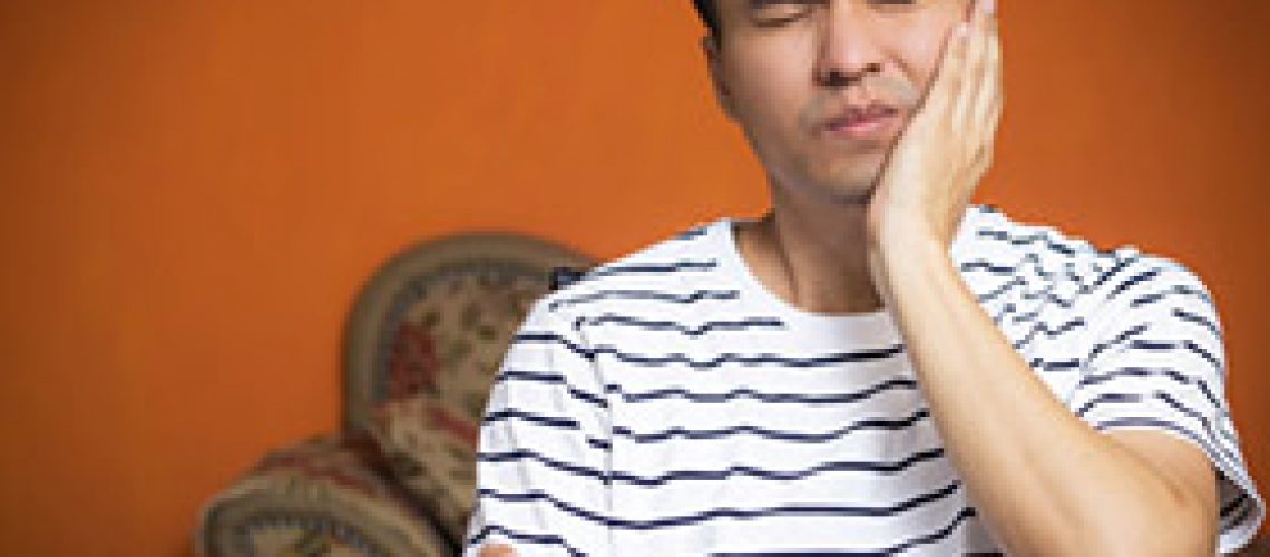 man with tooth pain