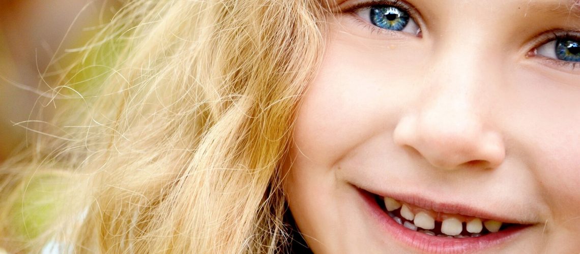 A close shot of a young girl smiling