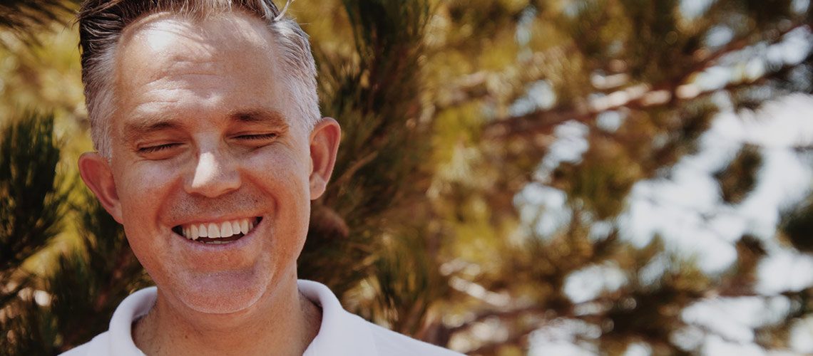 Man smiling with dental implant