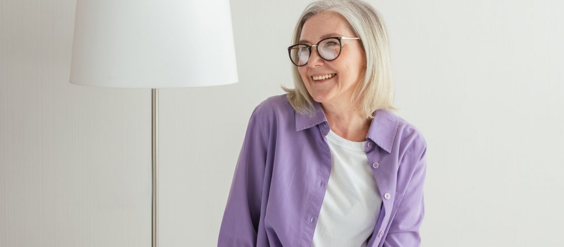 An older woman smiling brightly