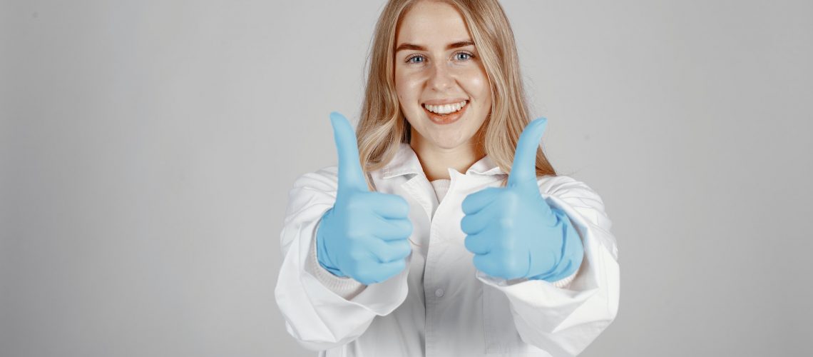 A dentist showing thumbs up