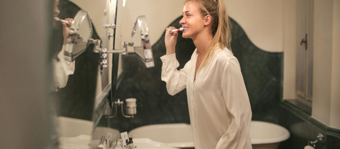 Woman brushing her teeth