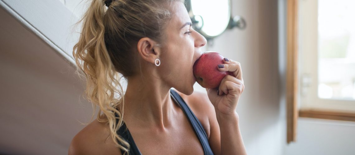 a woman eating an apple