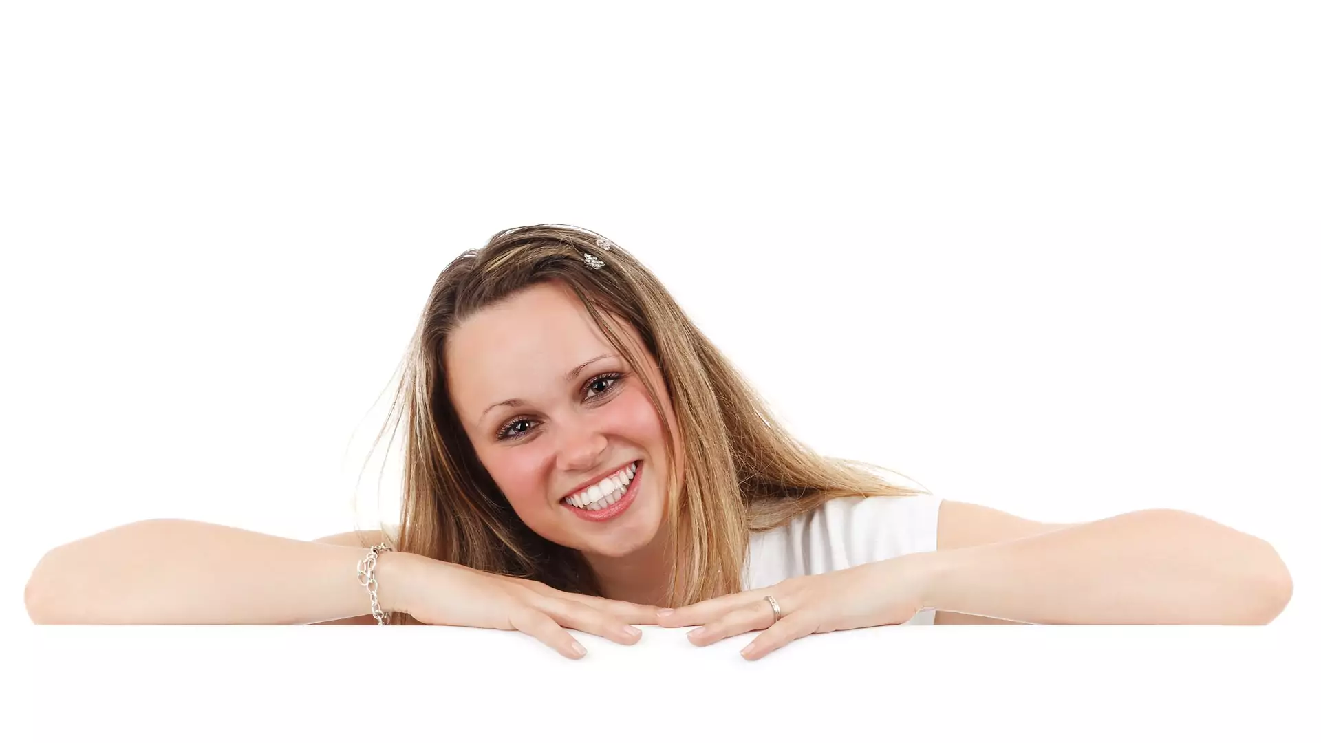 A smiling woman after receiving cosmetic dentistry treatment