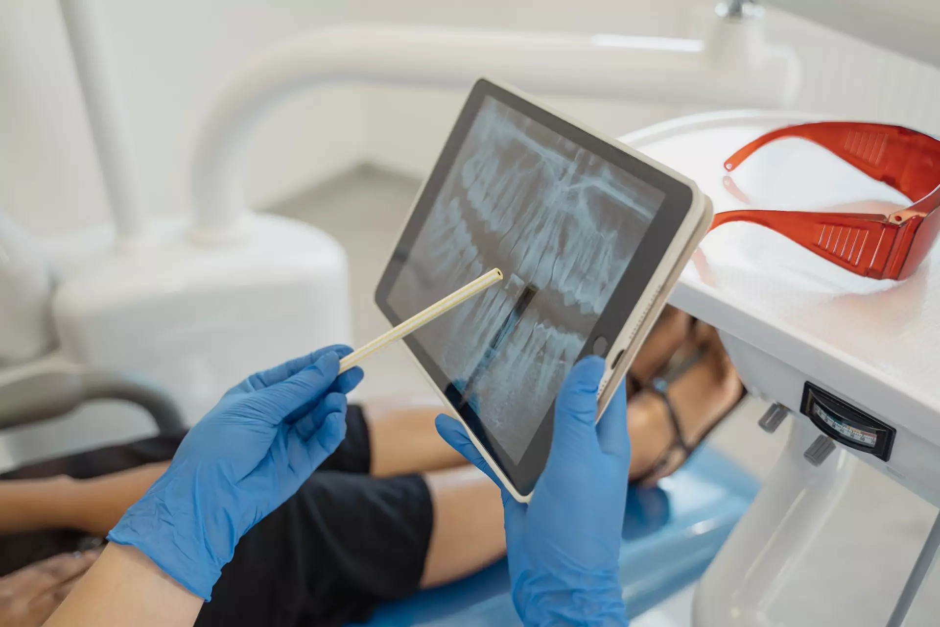 A dentist showing a digital X-ray to a patient