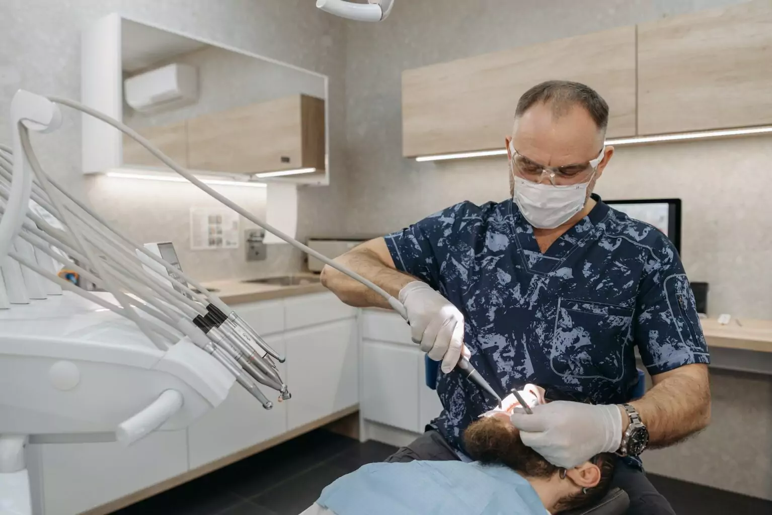 Dentist examining patient’s teeth