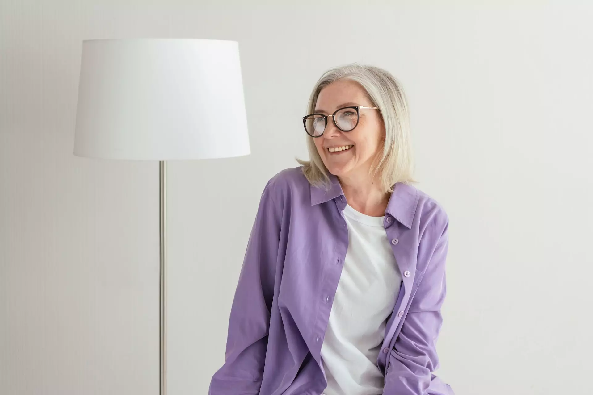 An older woman smiling brightly