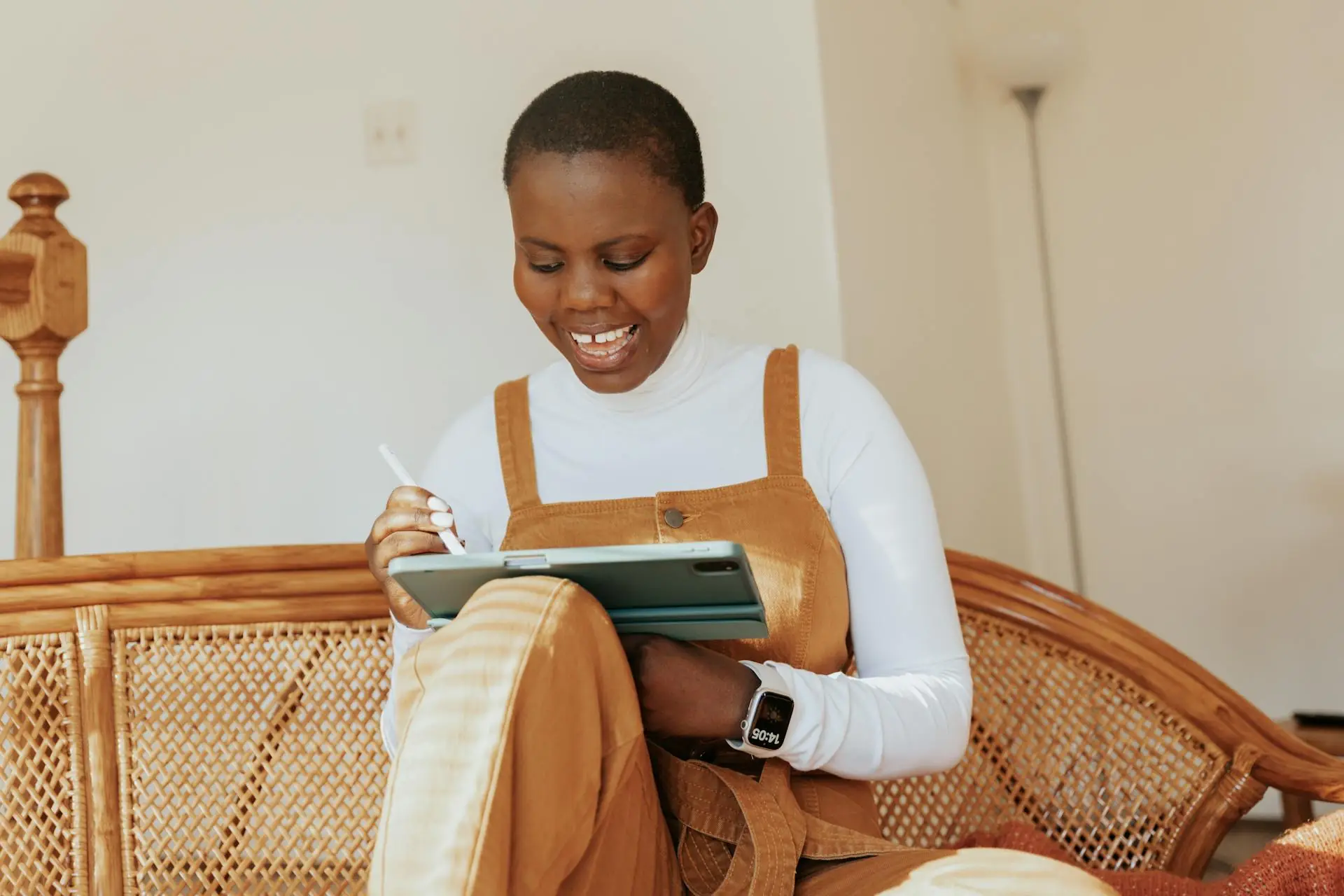 Woman smiling looking at tablet